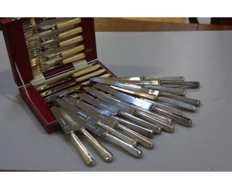 A set of eight Carrington, 130 Regent Street, London, stainless steel bladed Sheffield silver handled table knives, Sheffield