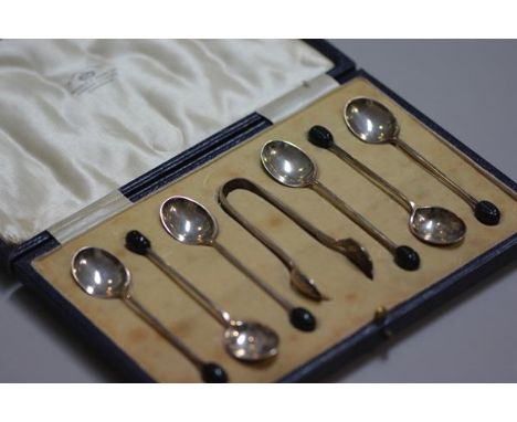 A set of six Sheffield silver bean handled coffee spoons, complete with tongs, in original fitted Mappin &amp; Webb case, £15