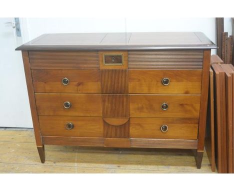 A cherrywood and mahogany Colonial commode, the rectangular top with moulded edge and crossbanded border above four graduated
