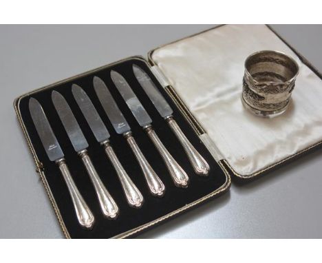 A set of six Sheffield silver handled steel bladed tea knives complete with original fitted case, Sheffield 1933 and a white 