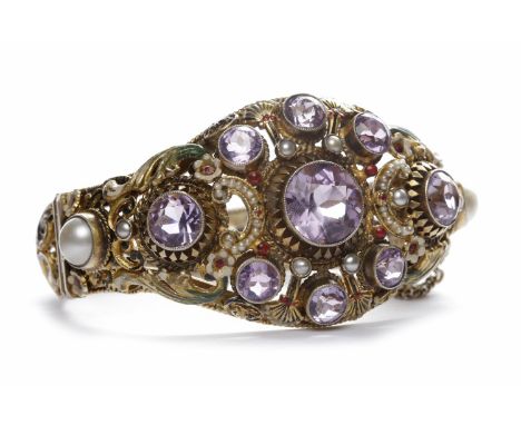 IMPRESSIVE EUROPEAN ENAMELLED AMETHYST AND PEARL SET BANGLEpierced and set with three principal round faceted amethysts, the 