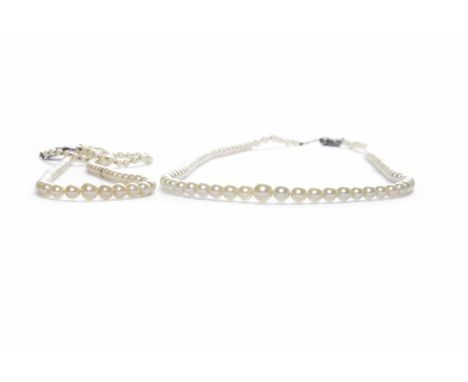 TWO GRADUATED PEARL NECKLACESone with a nine carat gold clasp, the other with a marcasite set clasp