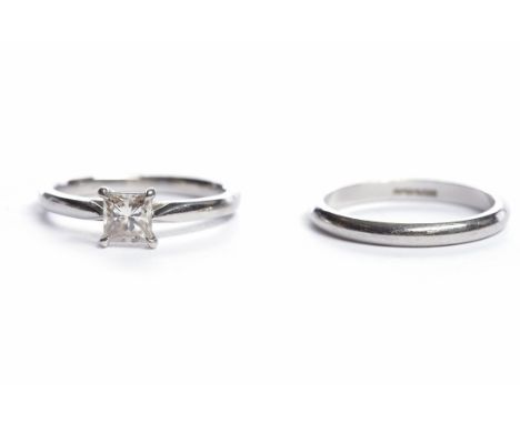 DIAMOND SOLITAIRE RINGthe princess cut diamond approximately 0.50 carats, in platinum, size J-K; together with a platinum wed