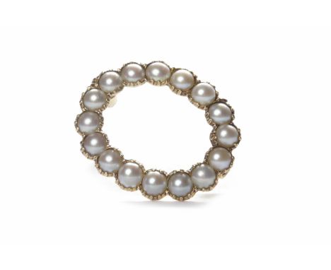 EDWARDIAN NINE CARAT GOLD PEARL SET BROOCHof oval form, open and set with split pearls, each pearl approximately 3mm diameter
