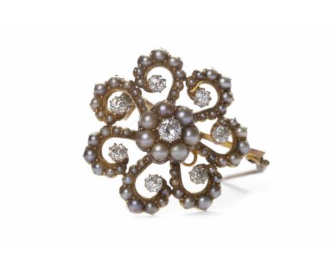 EDWARDIAN DIAMOND AND PEARL SET BROOCHof scalloped circular form, with a central round brilliant cut diamond of approximately