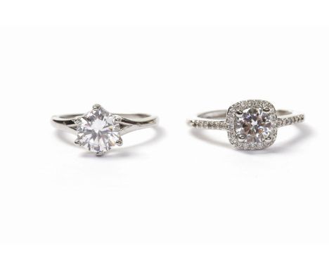 UNMARKED GEM SET SOLITAIRE RINGset with a single white gem 7mm diameter, size J; and another, size K (2)