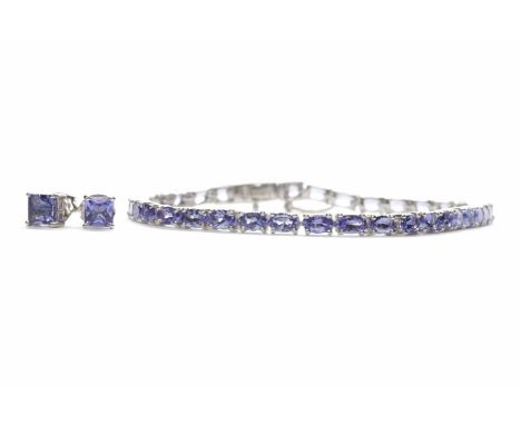 PAIR OF TANZANITE EARRINGSthe earrings marked for nine carat gold and set with princess cut tanzanites; along with an oval ta