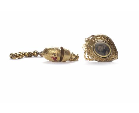 VICTORIAN PENDANT ON CHAINthe heart shaped pendant set with two portrait photographs, 25mm high, unmarked, on an eighteen car