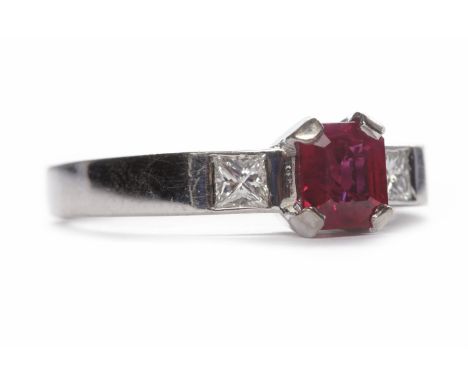 RUBY AND DIAMOND THREE STONE RINGthe central emerald cut ruby of approximately 1.10 carats flanked by two diamonds totalling 