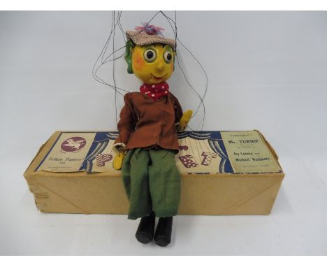 A boxed Pelham puppet 'Mr Turnip', circa 1958, believed restrung, original clothing, controller and box.