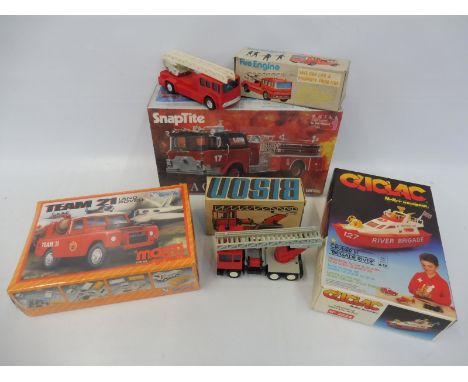Three boxed model kits, Fire Brigade related, plus a friction drive fire engine, made in Hong Kong etc.