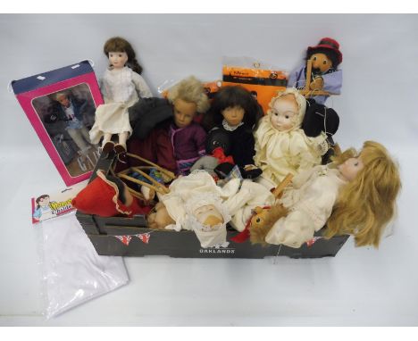 A selection of dolls and toys including a puppet, contemporary porcelain headed dolls, Barbie etc.