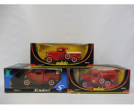 Three large scale Solido die-cast fire engines, two in Beverley Hills Fire Department livery.