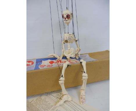 A boxed Pelham puppet 'Skeleton', with dedicated instructions. 