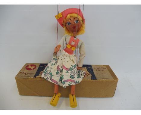 A boxed Pelham puppet 'Tyrolean Girl', late 1950s in remarkable condition, original box, original tissue paper, costume also 
