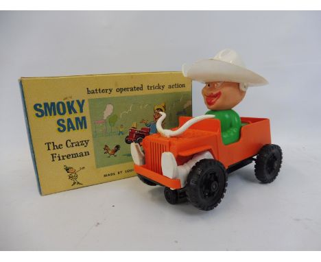 A boxed Louis Marx battery operated Smoky Sam 'The Crazy Fireman'. 