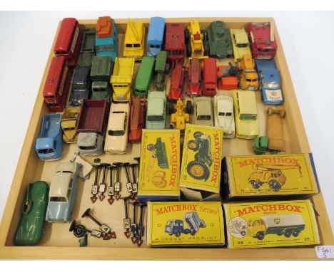 A quantity of unboxed Lesney Matchbox models including a D-Type Jaguar, a Hillman Minx and a Vauxhall Victor Estate Car, plus