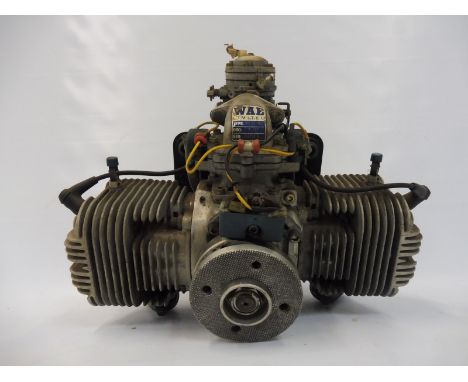 A Westlake ex military drone engine with a two blade wooden propeller. 