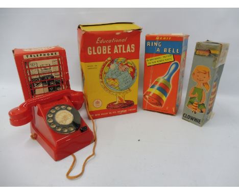 A boxed Chad Valley Educational Globe Atlas, a boxed Merit Ring A Bell and a Mechanical Telephone Money Box etc.