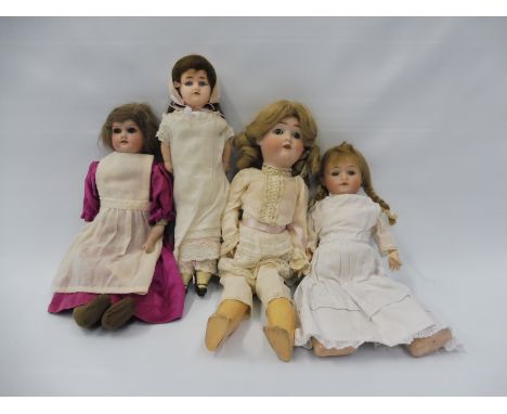 A selection of German bisque headed dolls including two Armand Marseille, a Max Handwerck, a Hermann Steiner and an early wax