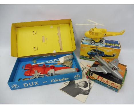 A boxed Dux Condor Helicopter, a 'Plastic Toy' friction Jet Fighter T-66 and a boxed Marx Mechanical Helicopter.