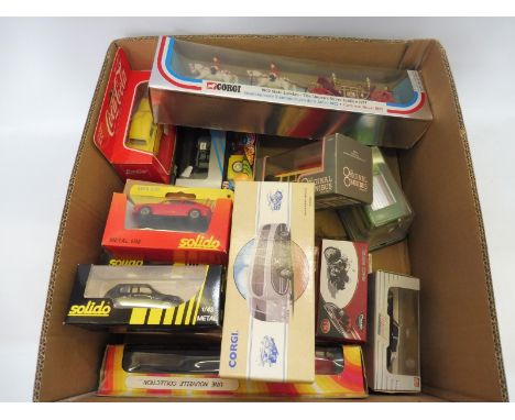 A quantity of boxed vehicles by Corgi, Minichamps and Solido etc.