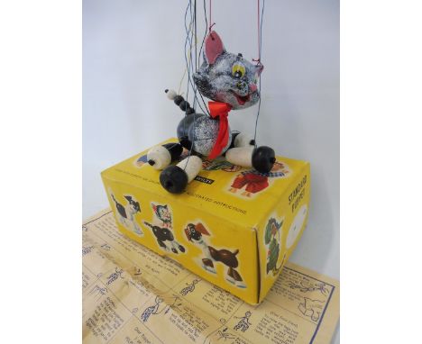 A boxed Pelham puppet 'Cat', early 1970s with original strings and controller, retaining whiskers and original red bow. 