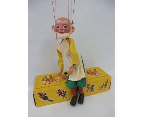 A boxed Pelham puppet 'Gepetto', mid to late 1960s, bald version with original strings, controller and box. 