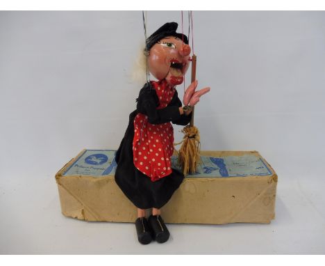 A boxed Pelham puppet 'Witch', late 1950s, still retaining broomstick, in generally good condition, teeth present, unmarked b