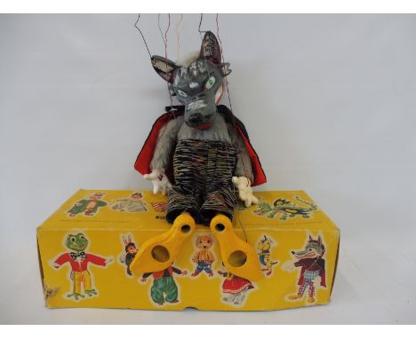 A boxed Pelham puppet 'Wolf', late 1960s, hardly played with, original strings and controller, furry coat version, beautifull