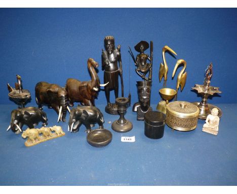 A quantity of carved Elephants, oriental and ethnic figures, ebonised candlestick and pin dish, carved bone Buddha, souvenir 
