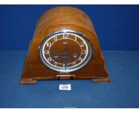 A Smiths Enfield Mantle clock having Arabic numerals, with pendulum, 12" wide x 8 3/4" high.