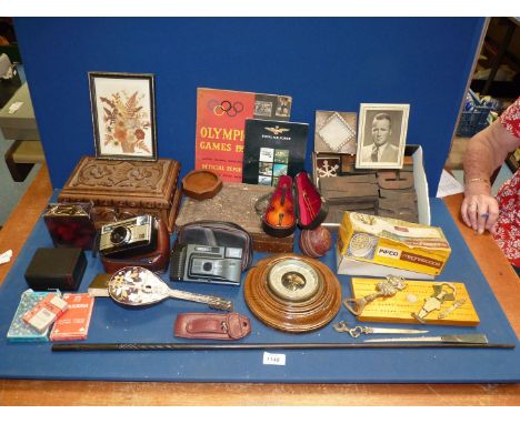 A quantity of miscellaneous including 1956 Olympic Games official report, Barometer a/f a novelty musical banjo, mini violin,