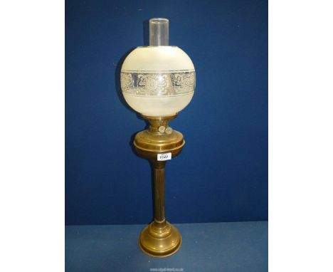 A brass oil lamp with brass reservoir and etched and frosted glass shade, 27" tall.