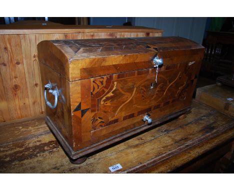 An 18th century German parquetry trunk of small dimensions beautifully inlaid and cross banded decoration with a range of dif