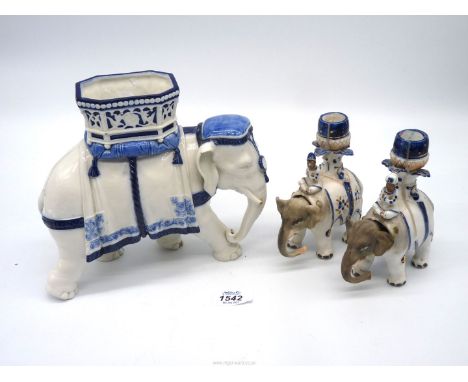 A Royal Worcester blue and white elephant, a/f and a pair of candle holders with nodding heads.