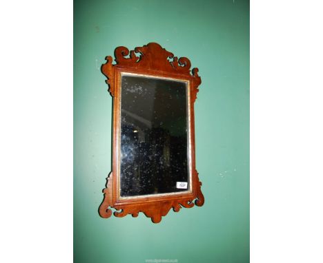 An old carved mahogany frame Wall Mirror with gilding to the inner and outer edges of the frame, 25'' high x 14 1/2'' wide.