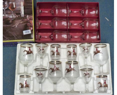 Two boxed sets of glasses, one by Dema and the other with hunting scene decoration.