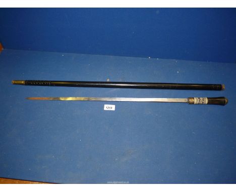 An Ebony Swordstick with Puma head knop and brass detail.