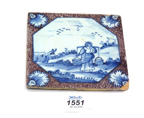 An 18th century English Delft tile painted in blue within a manganese border, chip to corner, 5 1/4" x 5 1/4".