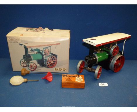 A boxed Mamod steam Tractor with steering rod, scuttle, etc.