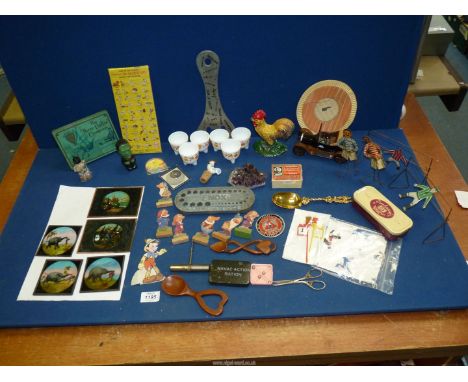 A quantity of miscellanea including cut-out figures, magic lantern slides, piece of quartz, etc.