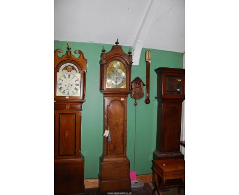 A late 18th c. Oak cased eight day Longcase Clock, the brass face with a silvered chapter ring with Roman numerals, inset sec