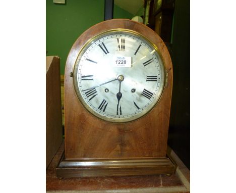 A large wooden cased striking Mantle Clock with silvered dial.