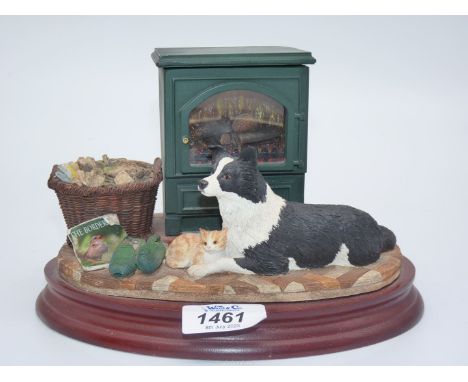 A Border Fine Arts "Warm Friends" with a light up stove and batteries or adapter powered (all absent), boxed and with certifi