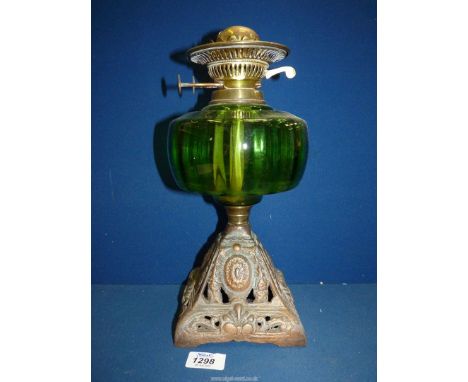 A square based Oil Lamp with green glass reservoir, no chimney or shade.