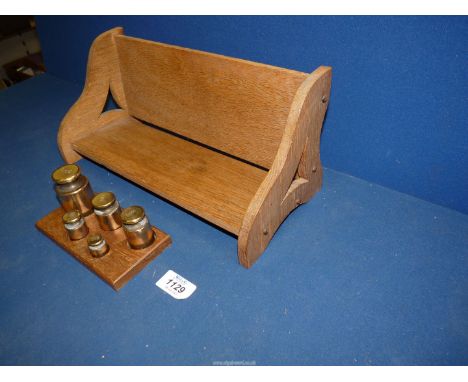 A 20th century Oak Art Nouveau book trough, 13 1/2" long, plus a set of five solid brass metric weights having crown stamp to