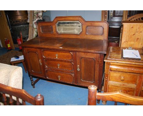 A 1930/40's Oak Sideboard having a parquetry style surface, an upstand with an eight sided bevelled mirror, the back with a f