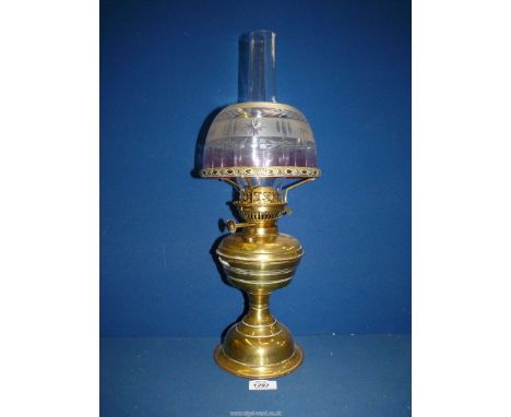 A brass based Oil Lamp with brass reservoir and pretty etched glass shade, 10 1/2'' tall.