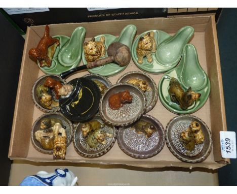 A quantity of Wade dogs, pipe rests and dogs in baskets etc.